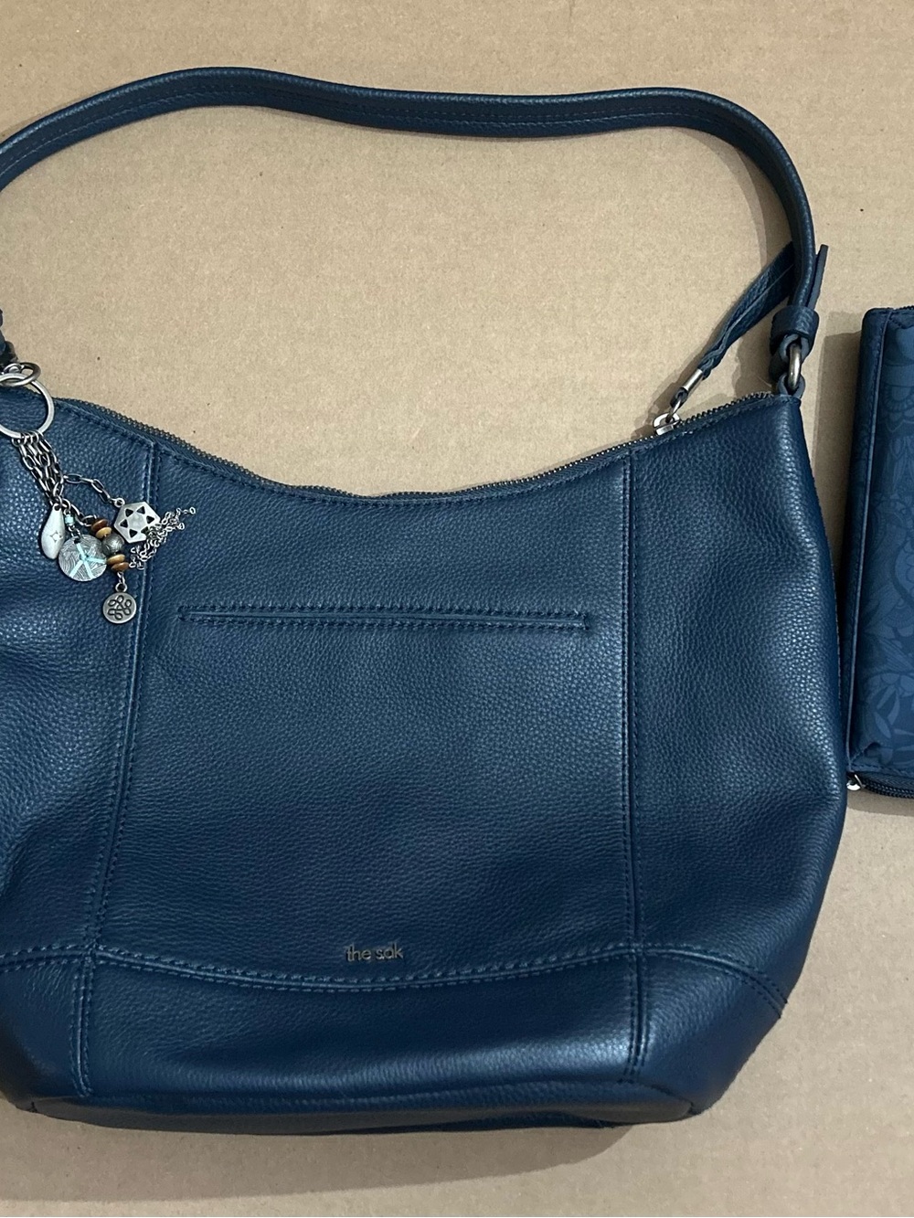 The Sak Navy Pebbled Leather Shoulder Bag with Charm